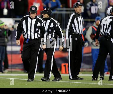 Officials, from left to right, replay official Kevin Brown, down judge  Michael Dolce, field judge Jimmy Buchanan, umpire Bryan Neale, referee  Shawn Smith, back judge Dino Paganelli, line judge Mark Steinkerchner and