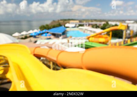 Blurred view from colorful slides in water park Stock Photo