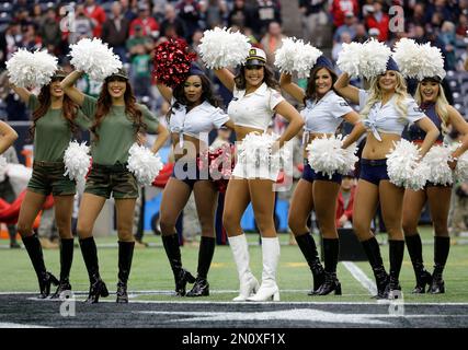 A Houston Texans cheerleader performs wearing a salute to service uniform  during an NFL football game against the New England Patriots, Sunday, Nov.  22, 2020, in Houston. (AP Photo/Matt Patterson Stock Photo 