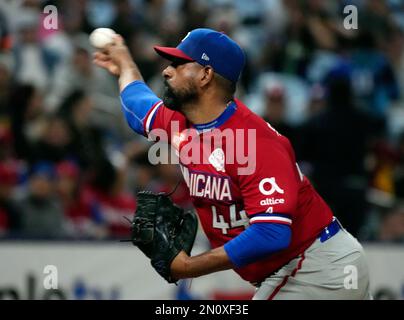 Dominican Republic pitcher Cesar Valdez throws against Venezuela during ...