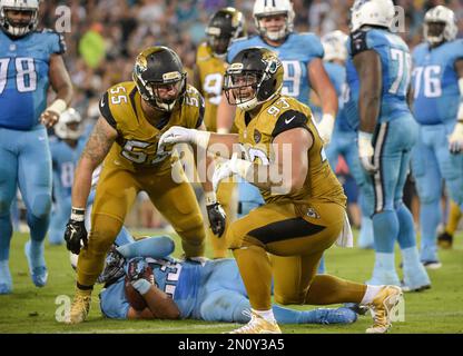 The Jacksonville Jaguars celebrate after stopping Tennessee Titans running  back Hassan Haskins (25) on a fourth and thirteen play in the second half  of an NFL football game, Saturday, Jan. 7, 2023