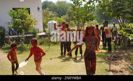 05 February 2023 Jaipur, Rajasthan, India. People throw colors to each other during the Holi celebration. Stock Photo