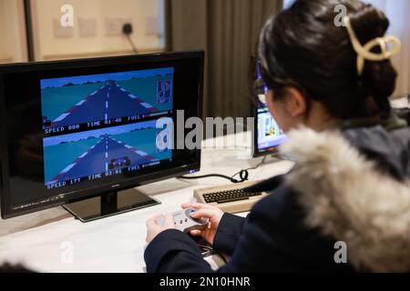 Bristol, UK. 04th Feb, 2023. A participant seen playing classic retro gaming consoles. The South West's No.1 Anime Con is held at Mercure Grand Hotel from 4th to 5th February. Participants can play video games, watch stage performances, and shop from Japanese Exhibitors. Credit: SOPA Images Limited/Alamy Live News Stock Photo