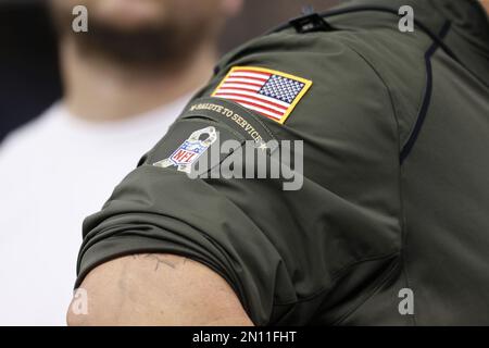 The NFL Salute to Service patch is seen on a jacket prior to an NFL football