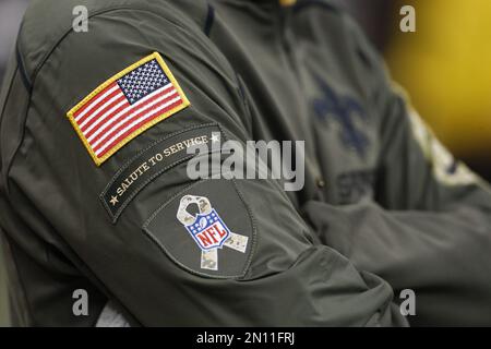 The NFL Salute to Service patch is seen on a jacket prior to an NFL football  game between the Miami Dolphins and the Arizona Cardinals, Sunday, Nov. 8,  2020, in Glendale, Ariz. (