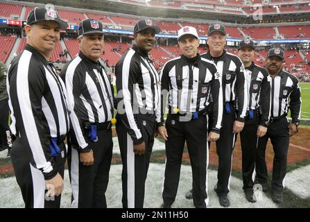 Replay official Jimmy Oldham, left, umpire Butch Hannah (40), umpire Barry  Anderson (20), head linesman Jim Mello (48), referee Brad Allen (122),  field judge Steve Zimmer (33), field judge Buddy Horton (82)