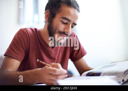Working hard for a good future. young university students during class. Stock Photo