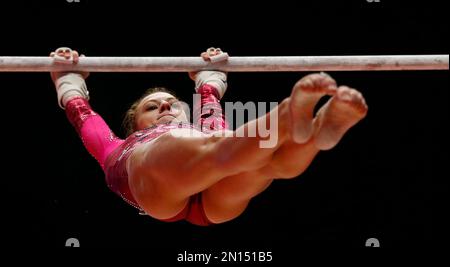 Kylie Dickson from Belarus performs during her beam routine as she