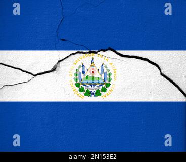 Earthquakes in El Salvador, flag El Salvador on a wall with cracks from an earthquake Stock Photo