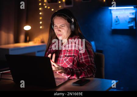 Frustrated annoyed woman confused by computer problem, stressed female student feels indignant about laptop crash, impotent problem, bad news online Stock Photo