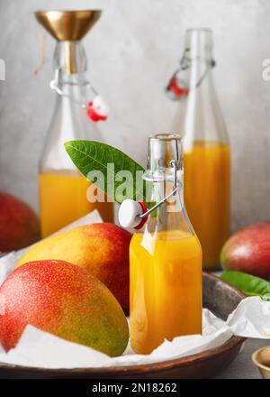 Jug of Mango and Orange Juice with Two Full Glasses Stock Photo - Alamy