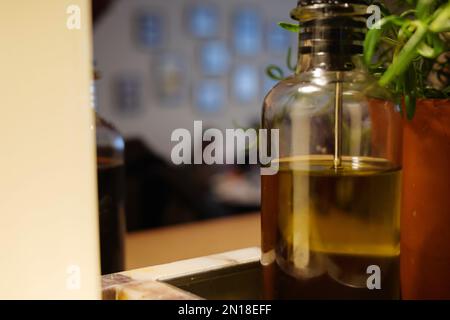 London - 02 27 2022: Olive oil cruet with lamp Stock Photo