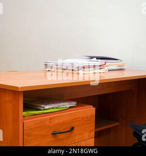 A stack of papers on a desktop without a computer Stock Photo