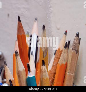 Different pencils in a jar on the table. Selective focus Stock Photo