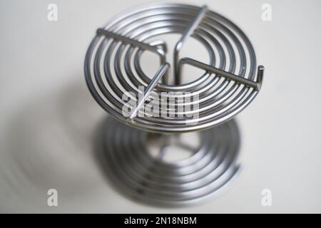 selective focus, Spiral roller for the development of 35 mm photographic film. Detail of analog film laboratory equipment Stock Photo