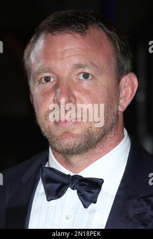 Guy Ritchie poses for photographers upon arrival at the opening gala ...