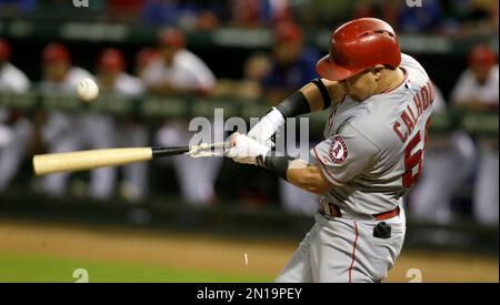 Texas Rangers' Kole Calhoun hits against the Arizona Diamondbacks during  the first inning of a spring training baseball game Tuesday, March 22,  2022, in Scottsdale, Ariz. (AP Photo/Matt York Stock Photo - Alamy