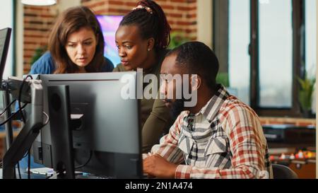 Group of software developers using creative skills to plan new advanced interface, working on engineering development. Colleagues creating industry production component in office. Stock Photo
