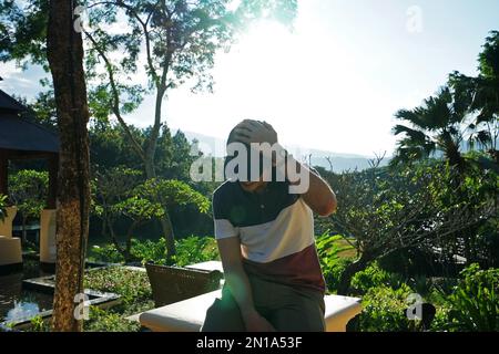 A man with Exterior design of natural hotel and luxury resort villas and pavilions acquainted with Thai culture on terraced rice field, Thailand Stock Photo