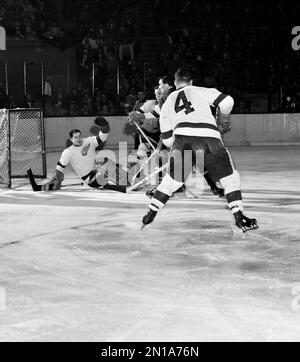 https://l450v.alamy.com/450v/2n1a76n/detroit-red-wing-goalie-glenn-hall-hits-the-ice-after-blocking-the-puck-to-halt-scoring-attempt-by-new-york-rangers-forward-dean-prentice-in-third-period-of-nhl-contest-at-madison-square-garden-march-15-1956-prentice-is-squeezed-between-detroit-forward-lorne-ferguson-and-defenseman-red-kelly-4-after-the-unsuccessful-shot-the-wings-tied-the-rangers-2-2-to-maintain-two-point-lead-over-the-new-yorkers-for-second-place-spot-in-the-league-ap-photomatty-zimmerman-2n1a76n.jpg