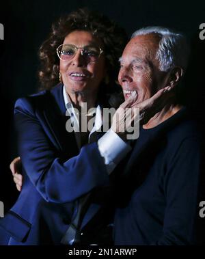 Italian fashion designer Giorgio Armani talks to models after presenting  his Giorgio Armani women's Spring-Summer 2012 fashion collection in Milan,  Italy, Monday, Sept. 26, 2011. (AP Photo/Luca Bruno Stock Photo - Alamy