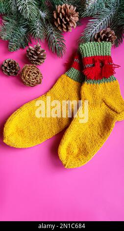 Knitted handmade items. Knitted fabric from colored thread. Bright background. copy space Stock Photo