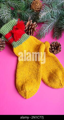 Knitted handmade items. Knitted fabric from colored thread. Bright background. copy space Stock Photo