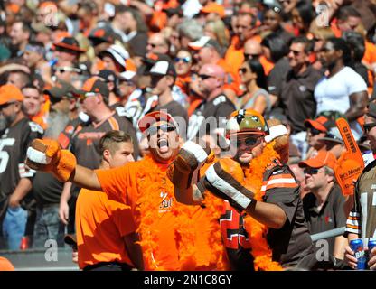 Cleveland Browns fans Jeremy Leyva, left, and Dominic Cruz cheer before an  NFL football game between