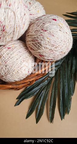 Knitted handmade items. Knitted fabric from colored thread. Bright background. copy space Stock Photo