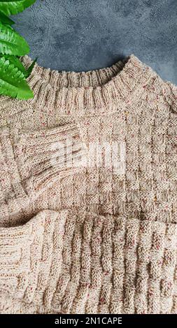 Knitted handmade items. Knitted fabric from colored thread. Bright background. copy space Stock Photo