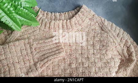 Knitted handmade items. Knitted fabric from colored thread. Bright background. copy space Stock Photo
