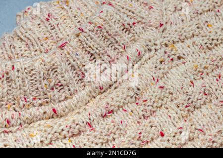 Knitted handmade items. Knitted fabric from colored thread. Bright background. copy space Stock Photo
