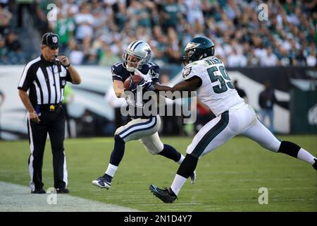 Dallas Cowboys' Cole Beasley, left, is tackled by Philadelphia