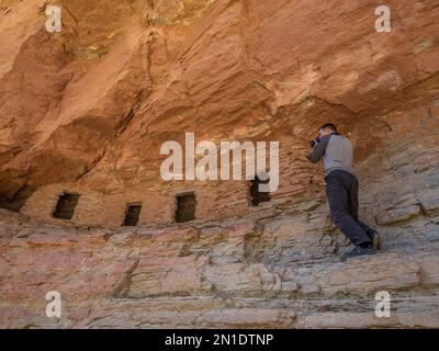 Photographing at the Puebloan granaries at Upper Nankoweap, Grand Canyon National Park, Arizona, United States of America, North America Stock Photo