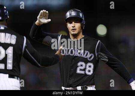 Colorado Rockies' Pat Valaika heads back to the dugout after being