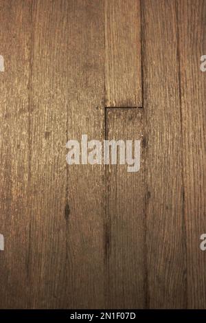 Traditional worn aged oak wood plank flooring. Stock Photo