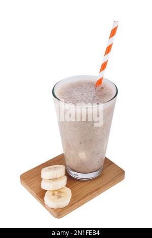 Glass of banana milkshake or smoothie with drinking straw isolated on white background Stock Photo