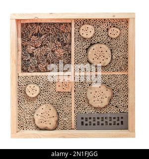 New wooden insect hotel isolated on a white background Stock Photo