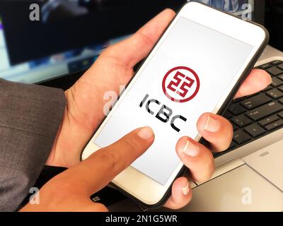 Modern banking icbc mobile application editorial background. Man using the chinese industrial banking application on mobile Stock Photo