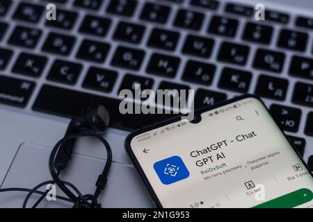 Screen with ChatGPT chat with AI or artificial intelligence. Man search for information using artificial intelligence chatbot developed by OpenAI Stock Photo