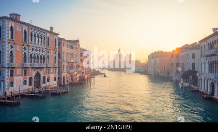 Venice, Italy. Cityscape image of Grand Canal in Venice, with Santa Maria della Salute Basilica in the background at winter sunrise. Stock Photo