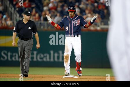 Philadelphia Phillies second baseman Chase Utley, left, puts out Washington  Nationals Nook Logan, caught trying to steal second base in the third  inning of a baseball game in Philadelphia on Thursday, July