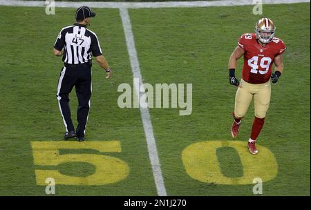 A gold 50 yard line marker is displayed on the field at Paul Brown Stadium  to promote Super Bowl 50 before an NFL preseason football game between the  Cincinnati Bengals and the