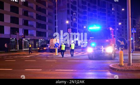 Warsaw, Poland. 2 December 2020. Fire service examining a crashed car in the street after a road traffic accident. Stock Photo