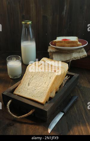 bread slices on a wooden tray Stock Photo