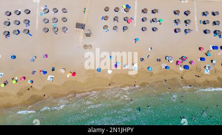 Picture dated July 14th shows the lucky holiday makers who have made it onto  the beach in Cala San Vicente,Ibiza,on Thursday morning.Many travellers Stock Photo