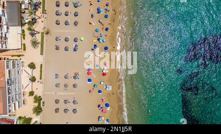 Picture dated July 14th shows the lucky holiday makers who have made it onto  the beach in Cala San Vicente,Ibiza,on Thursday morning.Many travellers Stock Photo