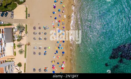 Picture dated July 14th shows the lucky holiday makers who have made it onto  the beach in Cala San Vicente,Ibiza,on Thursday morning.Many travellers Stock Photo