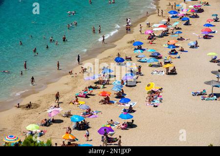 Picture dated July 14th shows the lucky holiday makers who have made it onto  the beach in Cala San Vicente,Ibiza,on Thursday morning.Many travellers Stock Photo