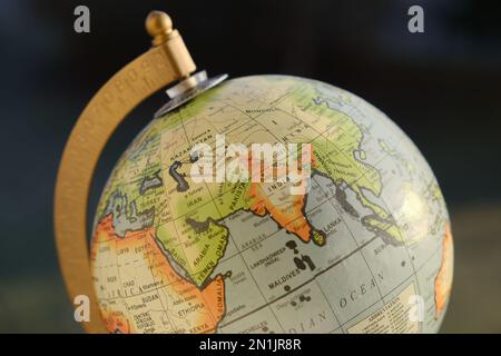 Photo of a gorgeous looking desk globe with focus on Asia - China, India and the Indian Ocean. Shot in natural sun light. Stock Photo